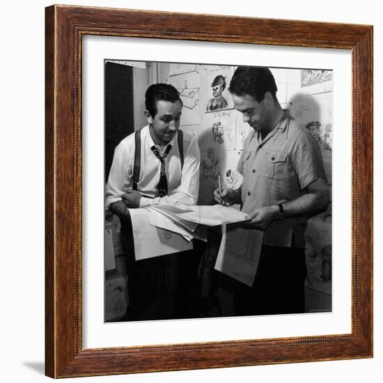 Director Walt Disney Looking over Sketches from His Latest Picture "Pinocchio."-Peter Stackpole-Framed Premium Photographic Print