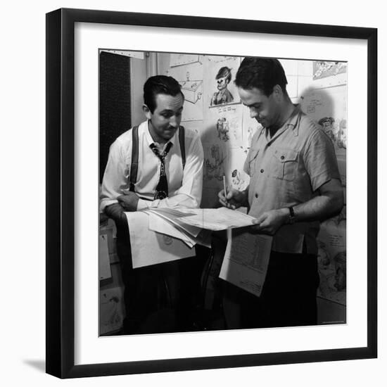 Director Walt Disney Looking over Sketches from His Latest Picture "Pinocchio."-Peter Stackpole-Framed Premium Photographic Print