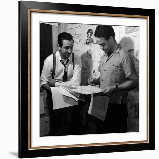 Director Walt Disney Looking over Sketches from His Latest Picture "Pinocchio."-Peter Stackpole-Framed Premium Photographic Print