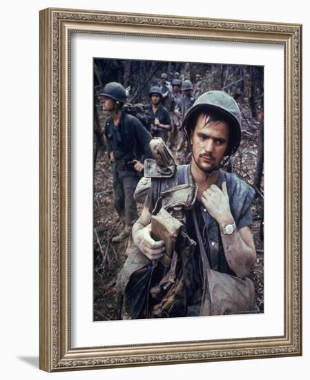Dirty, Exhausted Looking US Marine on Patrol with His Squad Near the DMZ During the Vietnam War-Larry Burrows-Framed Photographic Print