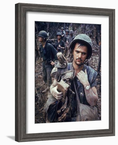 Dirty, Exhausted Looking US Marine on Patrol with His Squad Near the DMZ During the Vietnam War-Larry Burrows-Framed Photographic Print