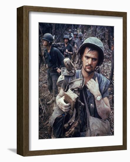 Dirty, Exhausted Looking US Marine on Patrol with His Squad Near the DMZ During the Vietnam War-Larry Burrows-Framed Photographic Print