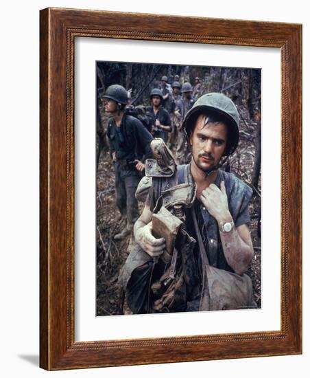 Dirty, Exhausted Looking US Marine on Patrol with His Squad Near the DMZ During the Vietnam War-Larry Burrows-Framed Photographic Print