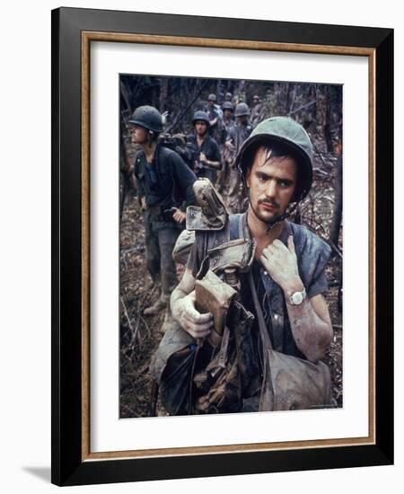 Dirty, Exhausted Looking US Marine on Patrol with His Squad Near the DMZ During the Vietnam War-Larry Burrows-Framed Photographic Print