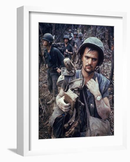 Dirty, Exhausted Looking US Marine on Patrol with His Squad Near the DMZ During the Vietnam War-Larry Burrows-Framed Photographic Print