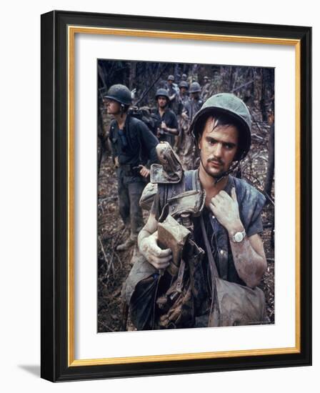 Dirty, Exhausted Looking US Marine on Patrol with His Squad Near the DMZ During the Vietnam War-Larry Burrows-Framed Photographic Print