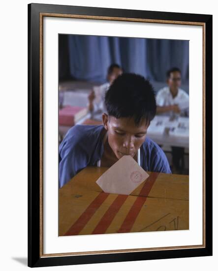 Disabled South Vietnamese Soldier Casting a Vote into a Ballot Box at Cong Hoa Army Hospital-Larry Burrows-Framed Premium Photographic Print