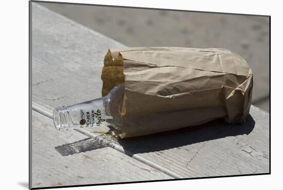 Discarded Rum Bottle In Paper Bag-Mark Williamson-Mounted Photographic Print