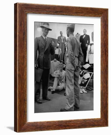 Discharged Gi Looking at New Suit Fashions-Nina Leen-Framed Photographic Print