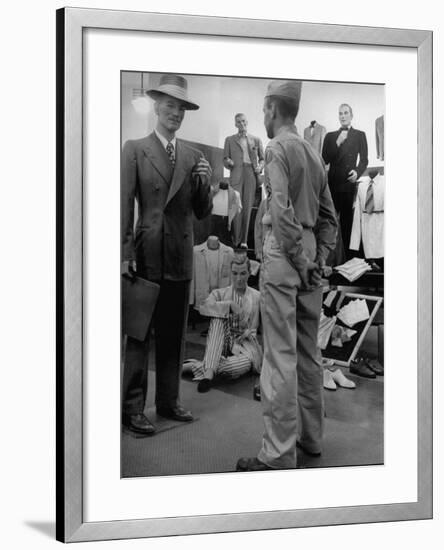 Discharged Gi Looking at New Suit Fashions-Nina Leen-Framed Photographic Print