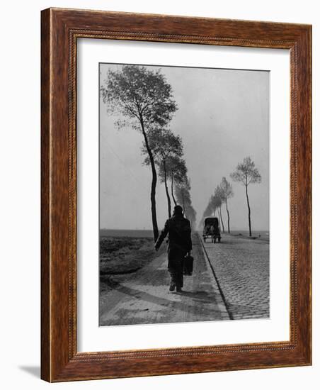 Displaced Person Returning Home from German Prison Camp, Walking Down Country Road-Ralph Morse-Framed Photographic Print