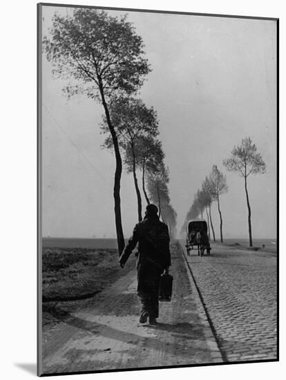 Displaced Person Returning Home from German Prison Camp, Walking Down Country Road-Ralph Morse-Mounted Photographic Print