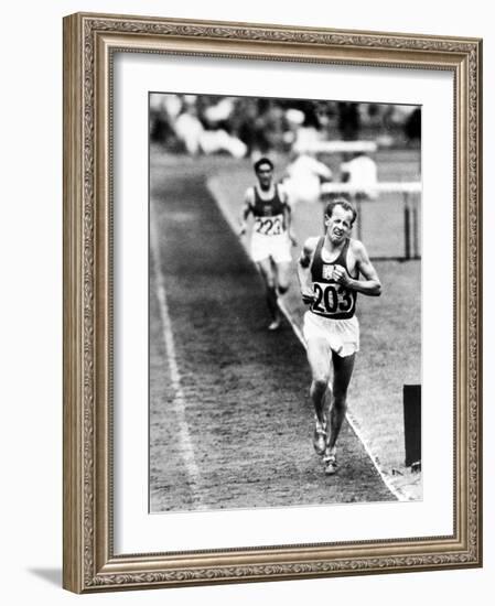 Distance Champion Emil Zatopek as He Set a New 10,000 Meter Record During the Olympic Games-Frank Scherschel-Framed Premium Photographic Print