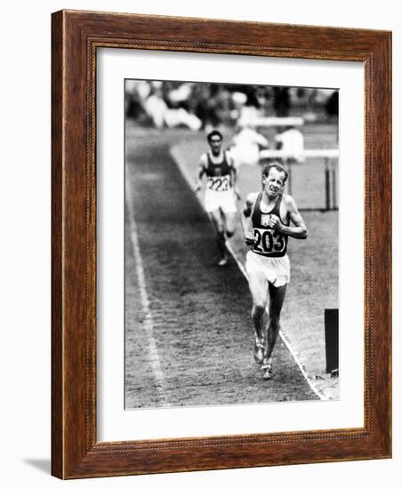 Distance Champion Emil Zatopek as He Set a New 10,000 Meter Record During the Olympic Games-Frank Scherschel-Framed Premium Photographic Print