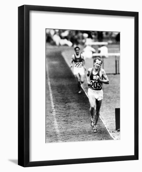 Distance Champion Emil Zatopek as He Set a New 10,000 Meter Record During the Olympic Games-Frank Scherschel-Framed Premium Photographic Print
