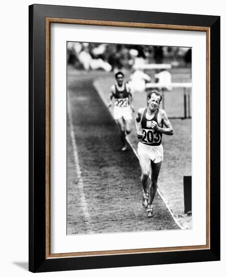 Distance Champion Emil Zatopek as He Set a New 10,000 Meter Record During the Olympic Games-Frank Scherschel-Framed Premium Photographic Print