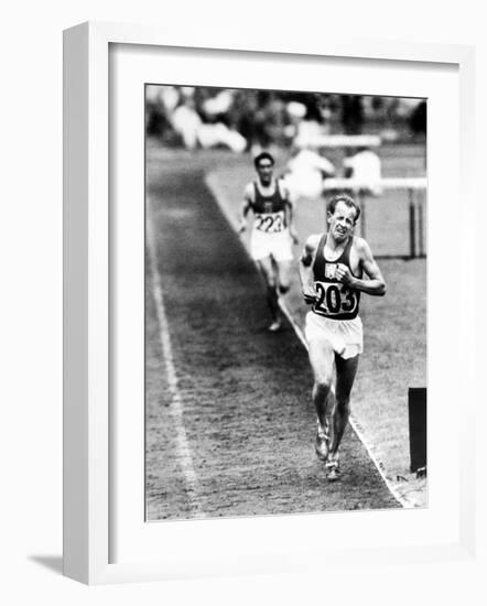 Distance Champion Emil Zatopek as He Set a New 10,000 Meter Record During the Olympic Games-Frank Scherschel-Framed Premium Photographic Print