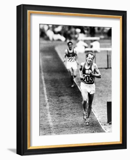 Distance Champion Emil Zatopek as He Set a New 10,000 Meter Record During the Olympic Games-Frank Scherschel-Framed Premium Photographic Print