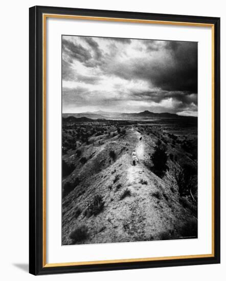 Distant of Artist Georgia O'Keeffe Taking Her Evening Walk at Ghost Ranch-John Loengard-Framed Premium Photographic Print