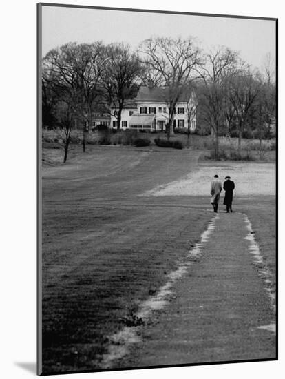Distant of Mathematicians Albert Einstein and Kurt Godel Taking a Walk-Leonard Mccombe-Mounted Premium Photographic Print