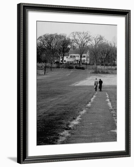 Distant of Mathematicians Albert Einstein and Kurt Godel Taking a Walk-Leonard Mccombe-Framed Premium Photographic Print