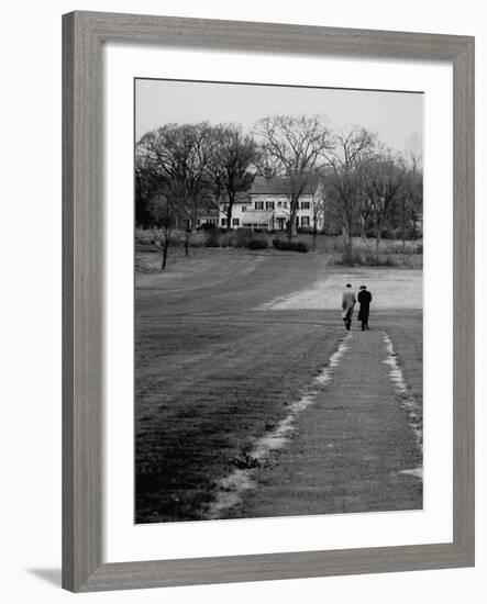 Distant of Mathematicians Albert Einstein and Kurt Godel Taking a Walk-Leonard Mccombe-Framed Premium Photographic Print