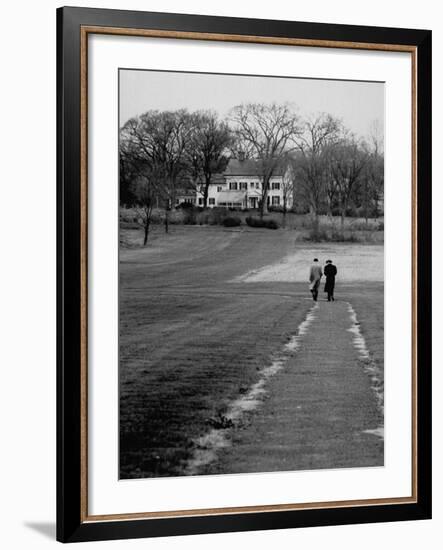 Distant of Mathematicians Albert Einstein and Kurt Godel Taking a Walk-Leonard Mccombe-Framed Premium Photographic Print