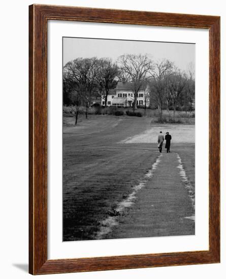 Distant of Mathematicians Albert Einstein and Kurt Godel Taking a Walk-Leonard Mccombe-Framed Premium Photographic Print