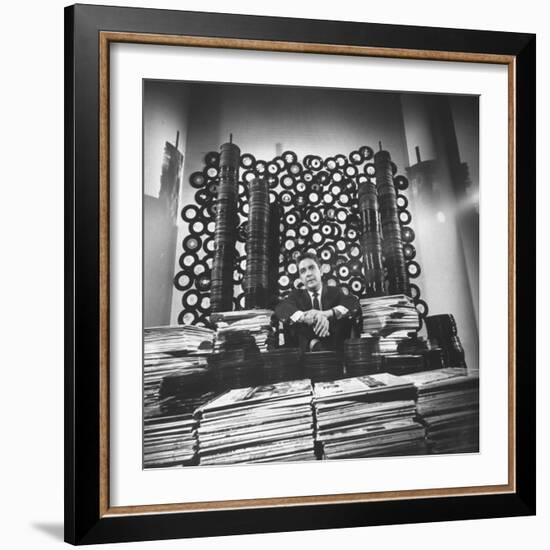 DJ William B. Williams Sitting Amid the 8,000 Records a DJ Receives Each Year from Record Companies-Joe Scherschel-Framed Premium Photographic Print