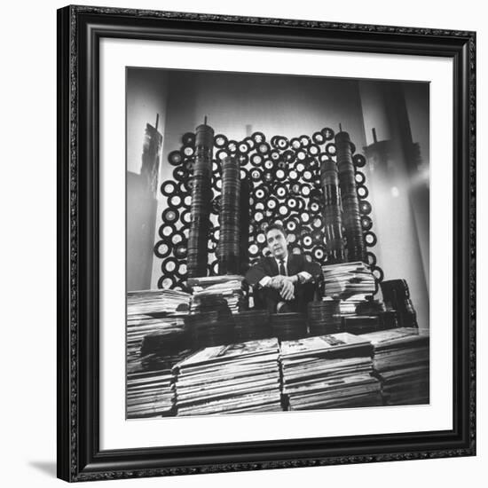 DJ William B. Williams Sitting Amid the 8,000 Records a DJ Receives Each Year from Record Companies-Joe Scherschel-Framed Premium Photographic Print