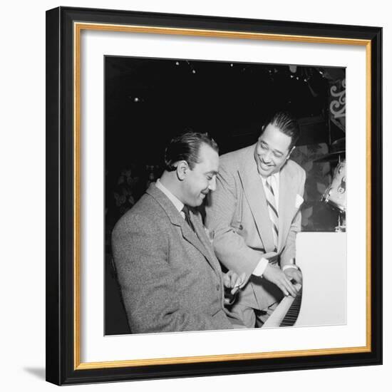 Django Reinhardt at the Aquarium in New York City, 1946-William Paul Gottlieb-Framed Photographic Print