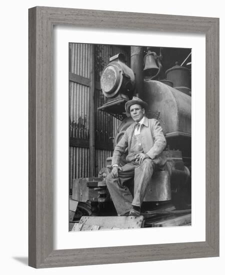 "Doby Doc" Sitting in Front of One of the First "Iron Horses" in the West-null-Framed Photographic Print