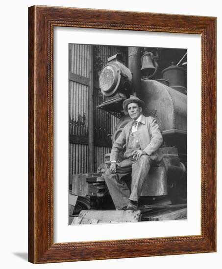 "Doby Doc" Sitting in Front of One of the First "Iron Horses" in the West-null-Framed Photographic Print