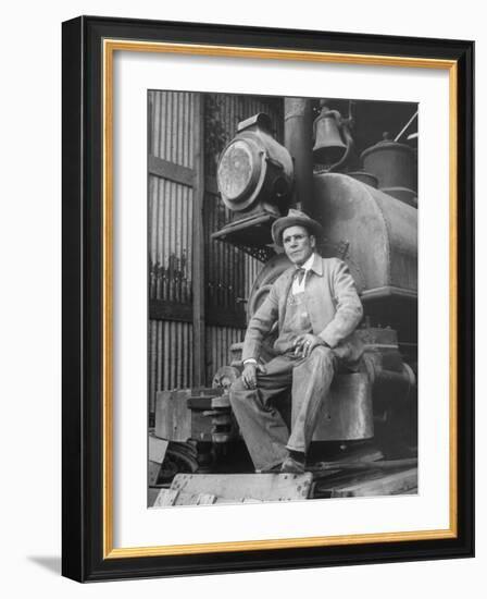 "Doby Doc" Sitting in Front of One of the First "Iron Horses" in the West-null-Framed Photographic Print