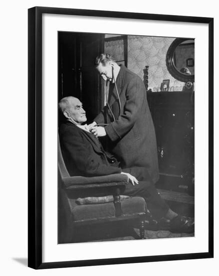 Doctor Making a House Call to an Ill Elderly Man, Listening to the Rhythm of His Heart-null-Framed Photographic Print