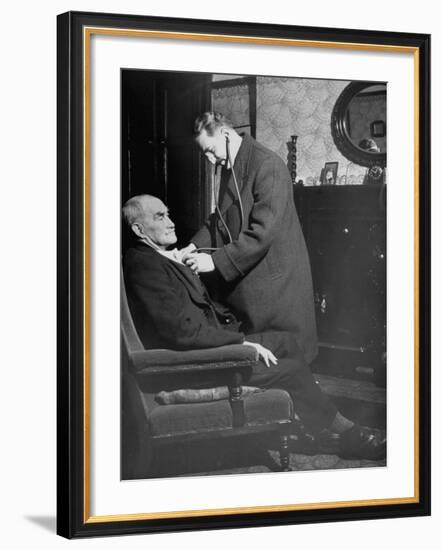 Doctor Making a House Call to an Ill Elderly Man, Listening to the Rhythm of His Heart-null-Framed Photographic Print