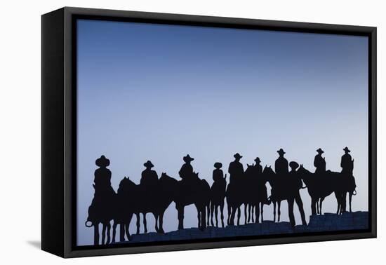 Dodge City Sign with Cowboy Silhouettes, Kansas, USA-Walter Bibikow-Framed Premier Image Canvas