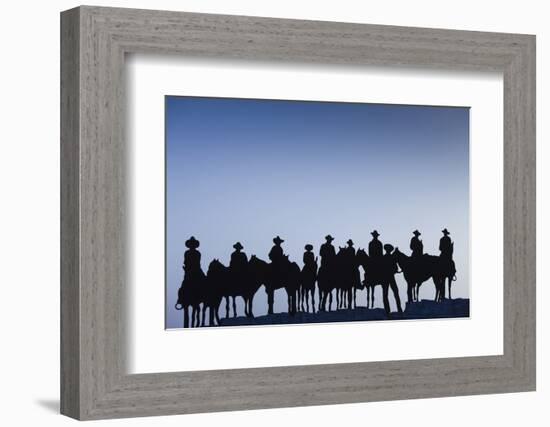 Dodge City Sign with Cowboy Silhouettes, Kansas, USA-Walter Bibikow-Framed Photographic Print