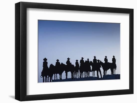 Dodge City Sign with Cowboy Silhouettes, Kansas, USA-Walter Bibikow-Framed Photographic Print