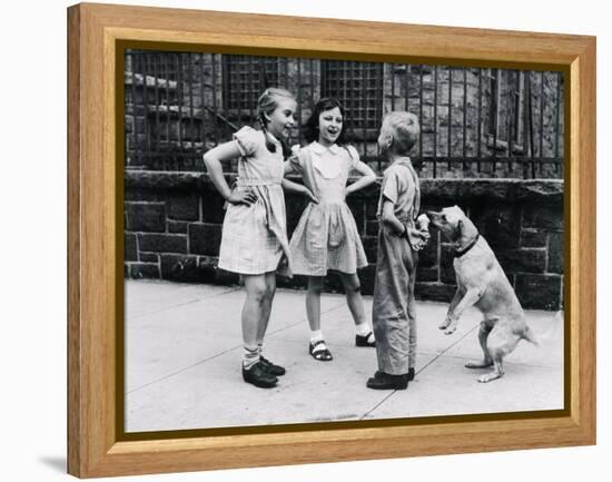 Dog Eating Ice Cream Cone Hidden behind Boy's Back-William Milnarik-Framed Premier Image Canvas