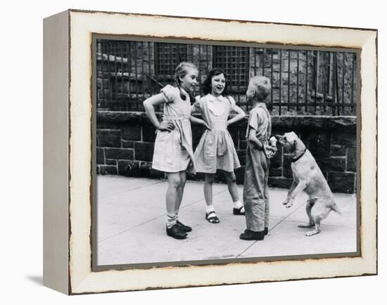 Dog Eating Ice Cream Cone Hidden behind Boy's Back-William Milnarik-Framed Premier Image Canvas