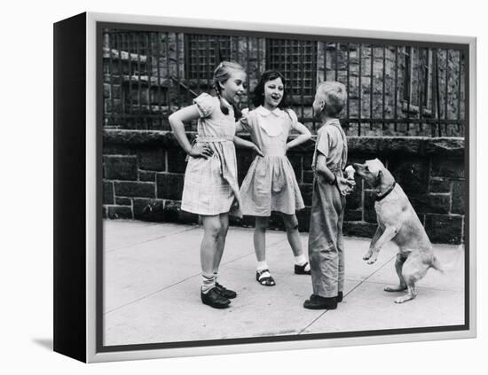 Dog Eating Ice Cream Cone Hidden behind Boy's Back-William Milnarik-Framed Premier Image Canvas