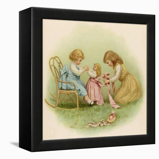 Doll is Dressed by Two Girls One in Front of Her While the Other Ties Her Sash Behind-Ida Waugh-Framed Premier Image Canvas