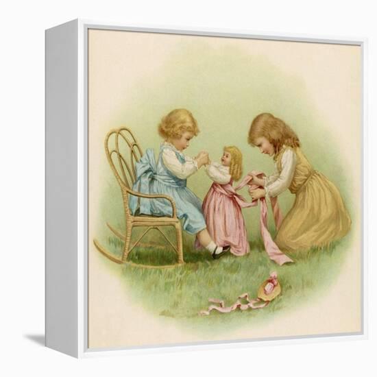 Doll is Dressed by Two Girls One in Front of Her While the Other Ties Her Sash Behind-Ida Waugh-Framed Premier Image Canvas