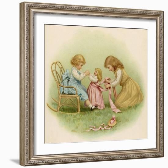 Doll is Dressed by Two Girls One in Front of Her While the Other Ties Her Sash Behind-Ida Waugh-Framed Photographic Print