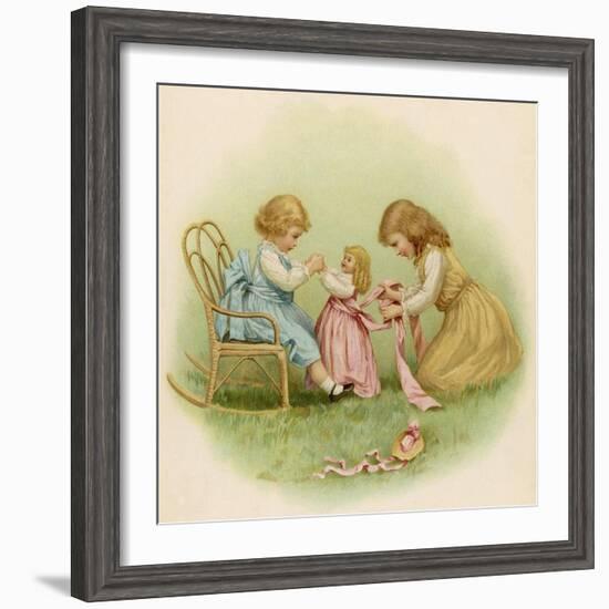 Doll is Dressed by Two Girls One in Front of Her While the Other Ties Her Sash Behind-Ida Waugh-Framed Photographic Print