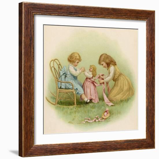 Doll is Dressed by Two Girls One in Front of Her While the Other Ties Her Sash Behind-Ida Waugh-Framed Photographic Print