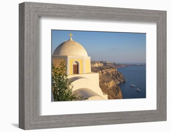 Domed church with steeple in town of Fira, Santorini, Greece.-Michele Niles-Framed Photographic Print