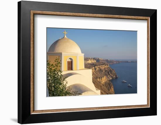 Domed church with steeple in town of Fira, Santorini, Greece.-Michele Niles-Framed Photographic Print