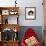 Domestic Cat, 6-Month, Black-And-White Semi-Longhaired Female Cat Lying on Floor-Jane Burton-Framed Photographic Print displayed on a wall